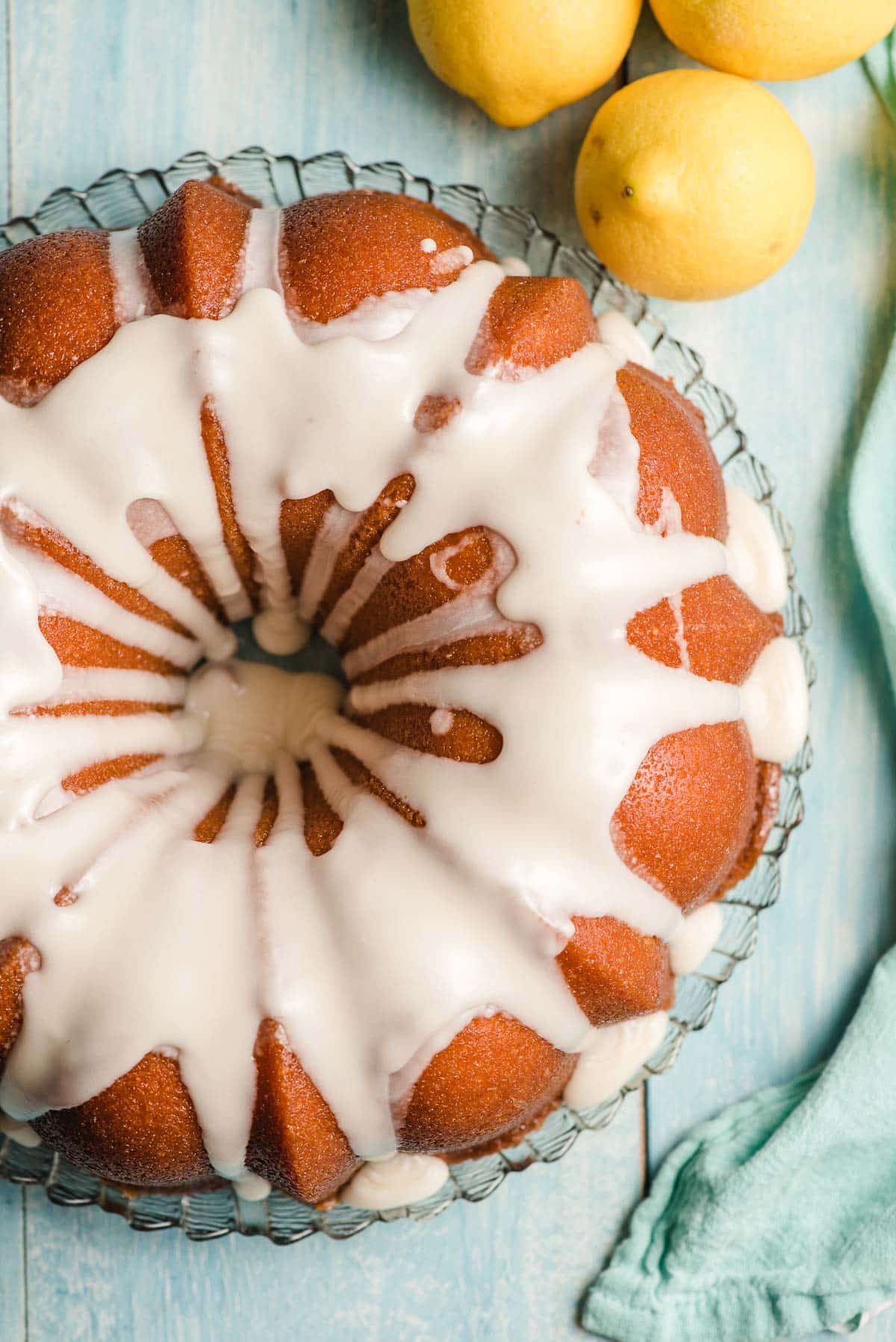 Icing cascading down the sides of a leon bundt cake.