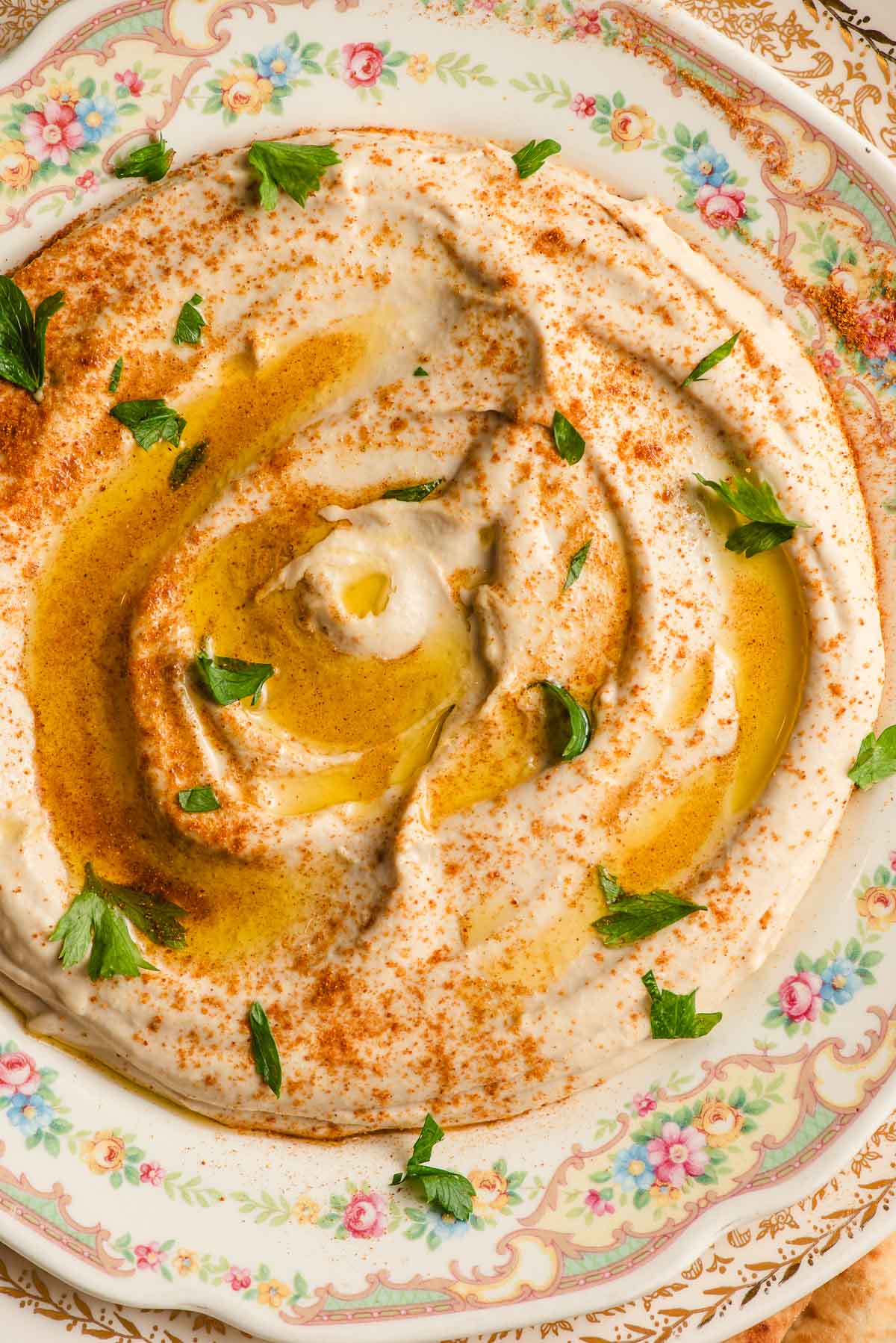 Homemade linty hummus with oil on a plate.