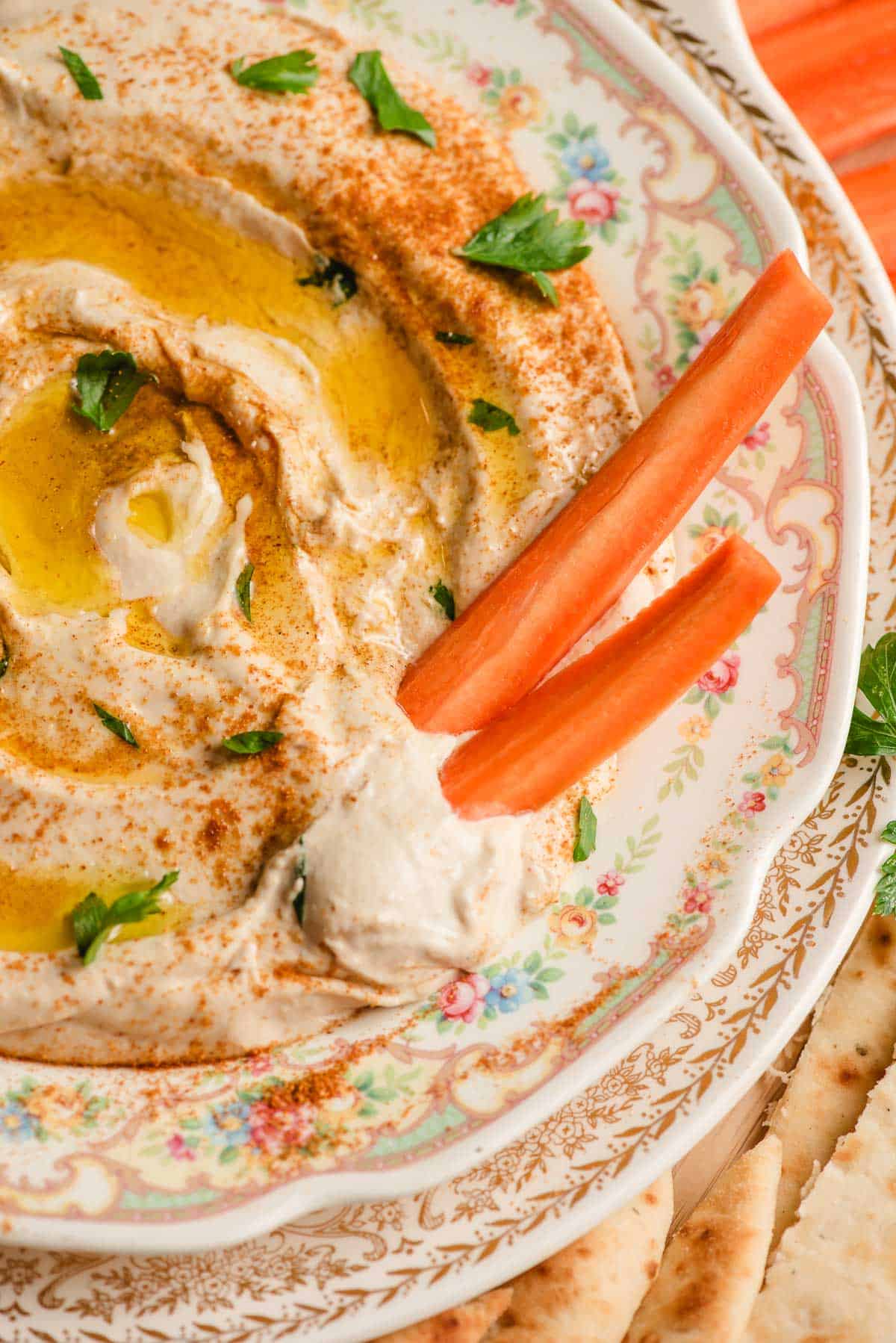 Carrot sticks in a trencher of linty homemade hummus.