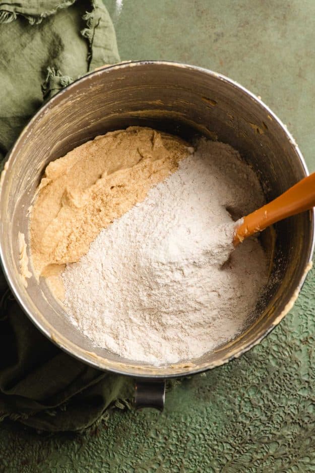 Flour added to spiced cake batter.