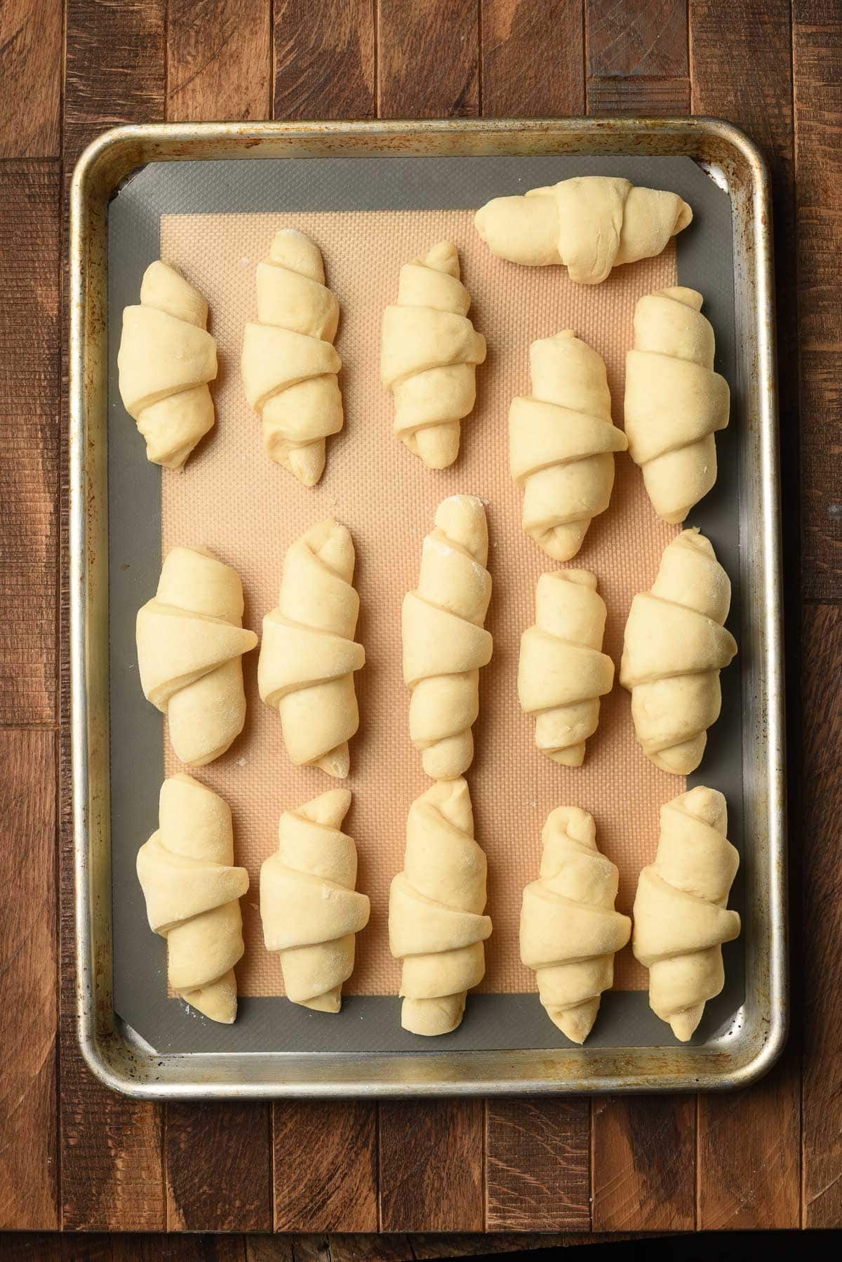 Rolled butterhorn dough on a sultry sheet.