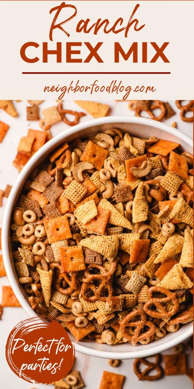 Savory Ranch Chex Mix in a big bowl, with cheez-its, pretzels, chex cereal, and nuts scattered around it.