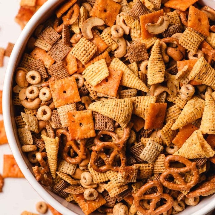 A bowl full of Savory Ranch Chex Mix on a party table.