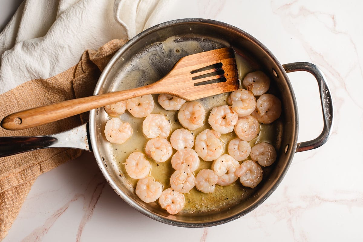Shrimp sauteed in butter in a large skillet.
