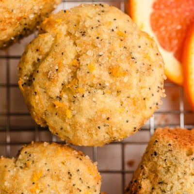 Orange muffins sprinkled with coarse sugar and orange zest.