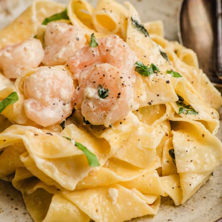 Pappardelle pasta with shrimp on a plate.