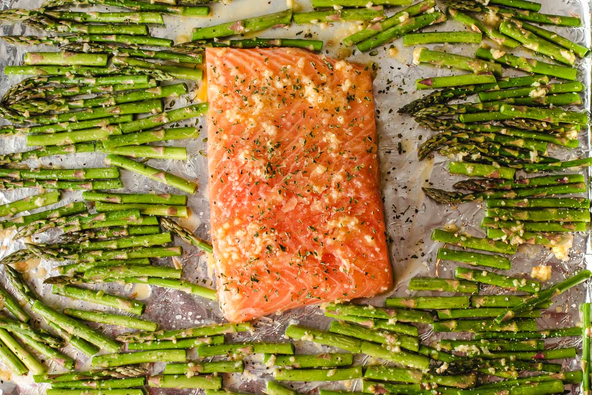 Salmon and asparagus with lemon and garlic on a sheet pan.