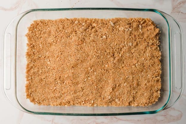 A graham cracker crust in a 9 x 13 inch pan.