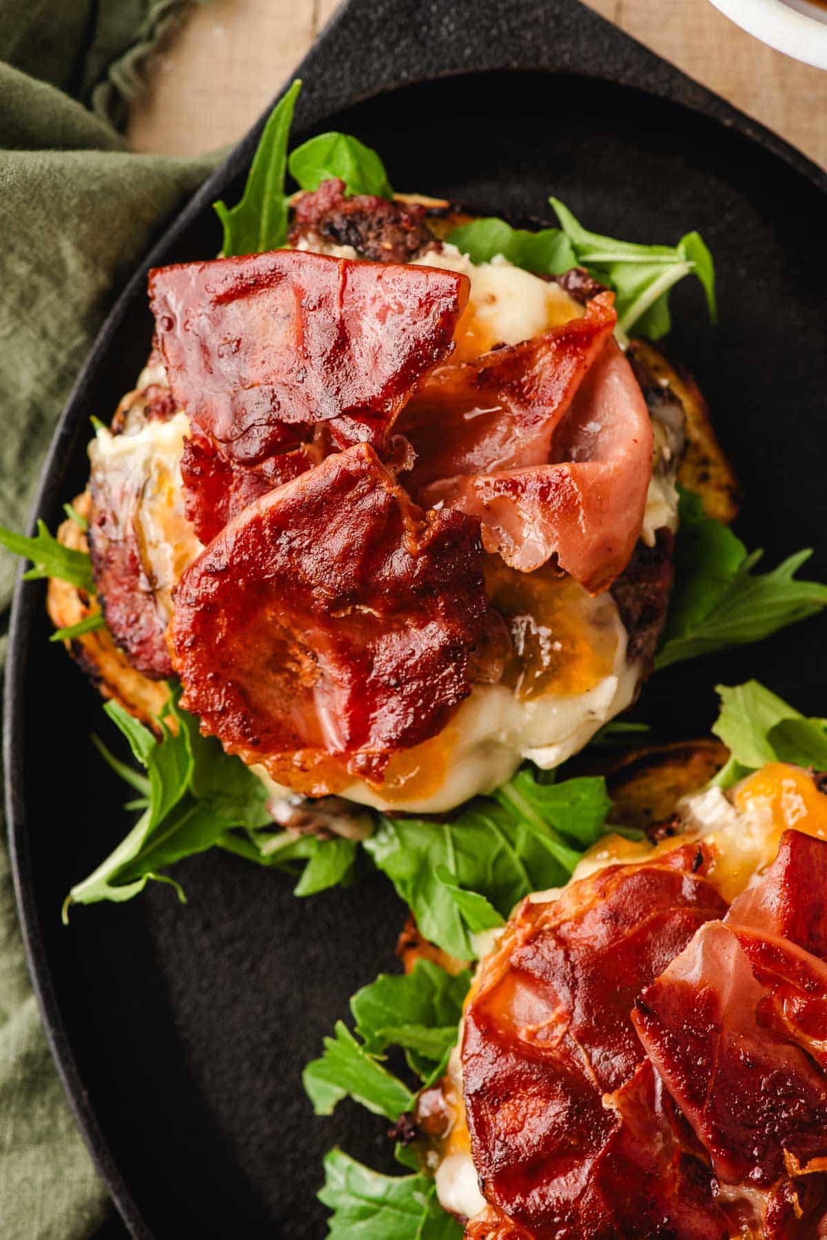 Brie burger topped with crispy prosciutto.
