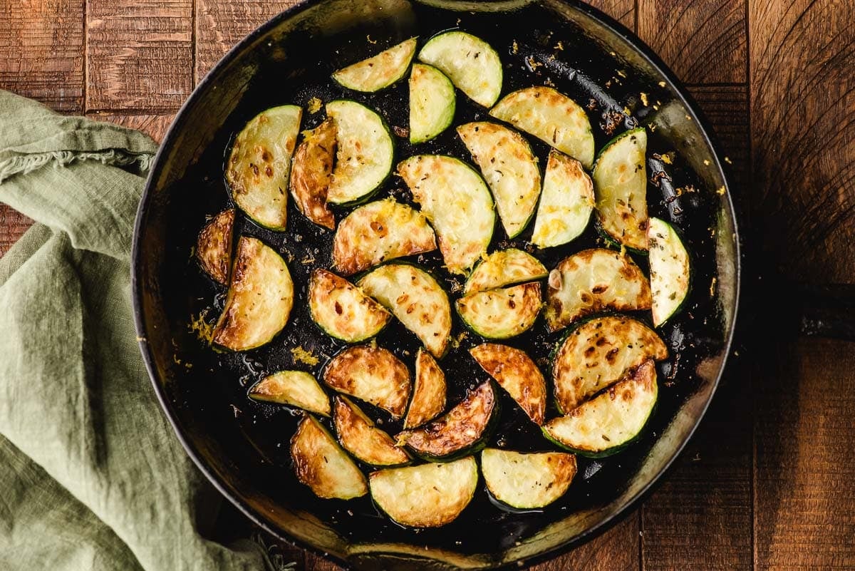 Sauteed zucchini in a cast iron skillet.