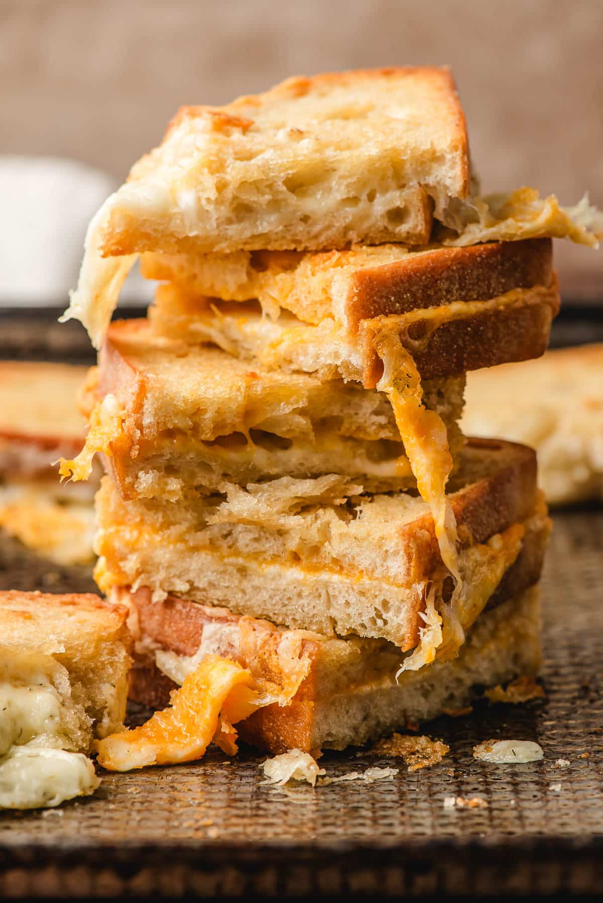 Stack of grilled cheese sandwiches.