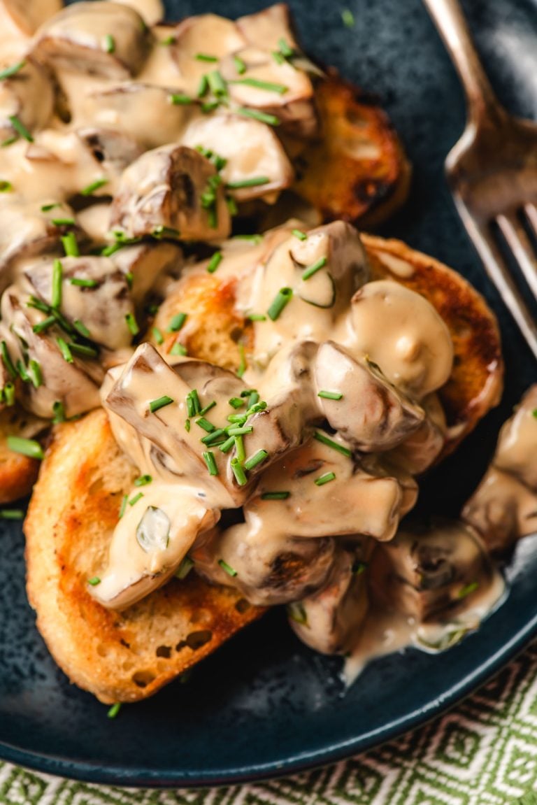Pan grilled toast topped with creamy mushrooms.