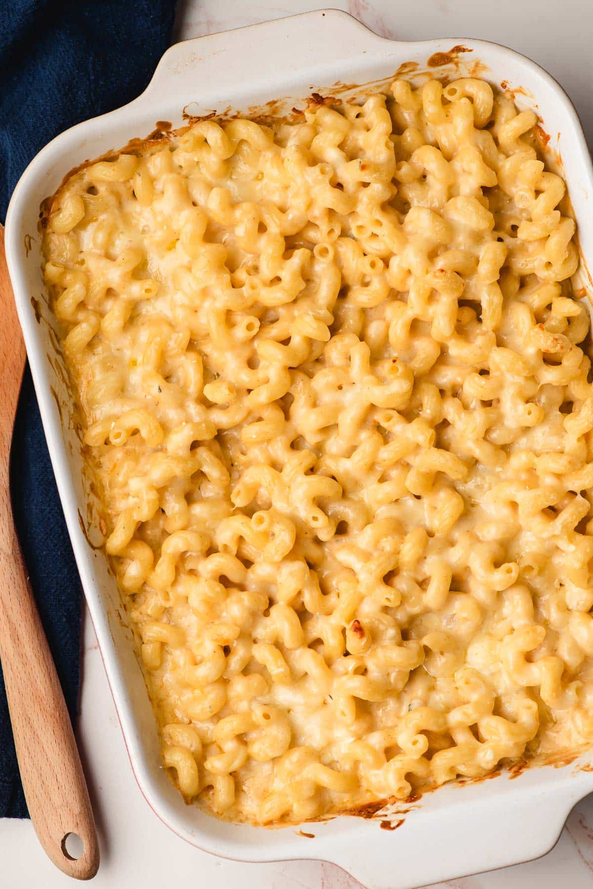 Four Cheese Baked Mac and Cheese in a casserole dish.