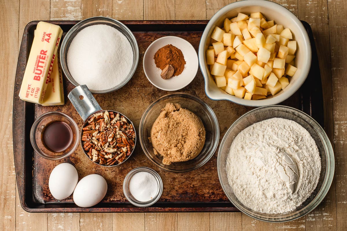 Ingredients for apple dapple cake on a sheet pan.