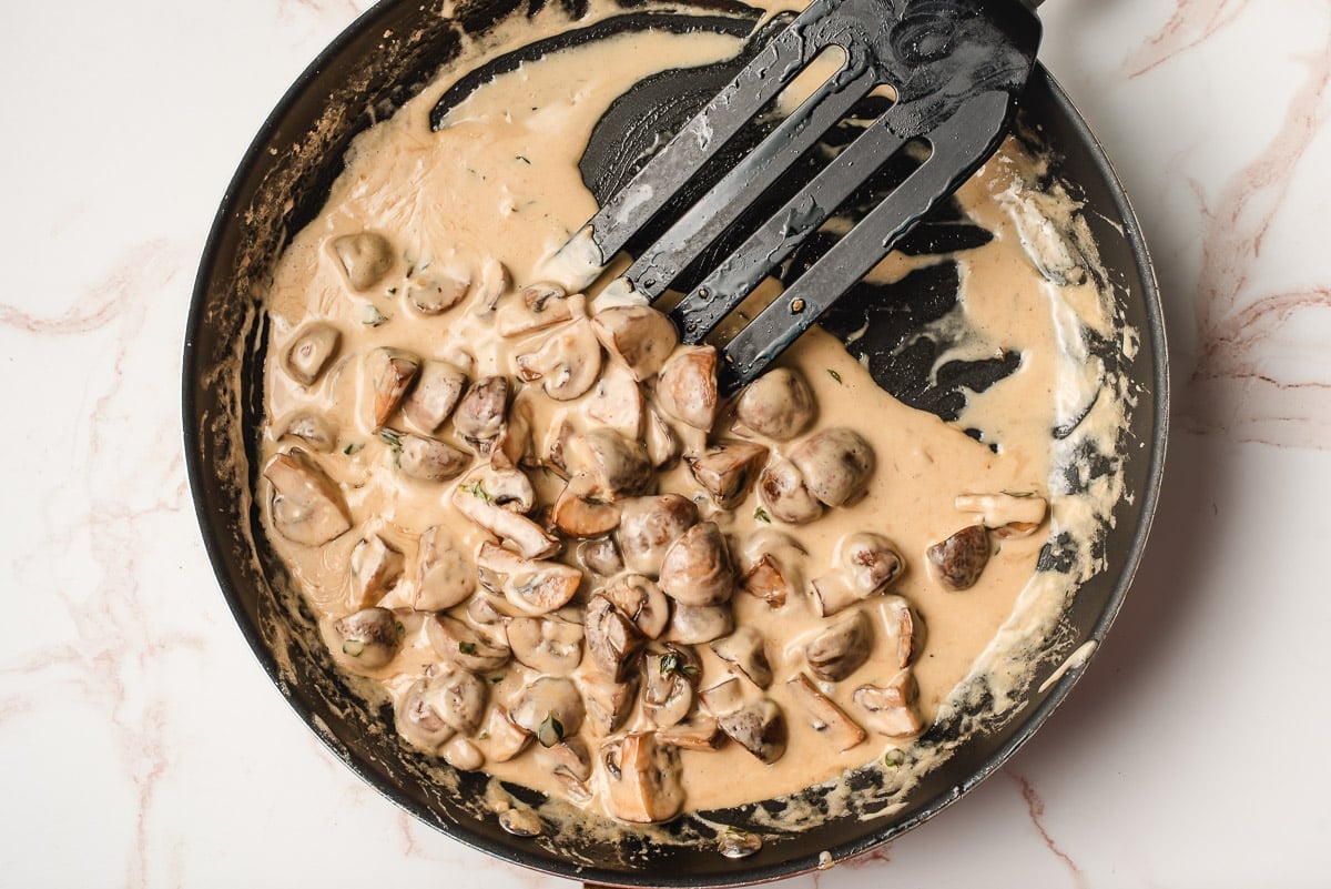 Cream cooked down until thickened with sauteed mushrooms.