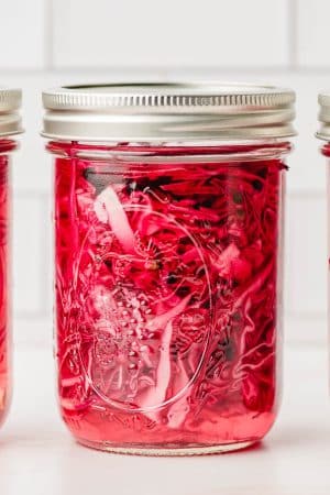 Quick pickled red onion in a mason jar.