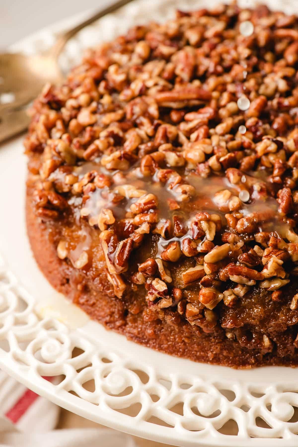 Pecan Upside Down Cake on a decorative cake pan.