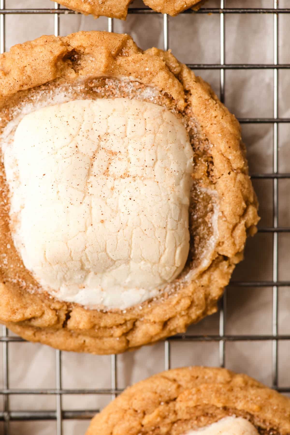Peanut butter marshmallow cookie on a cooling rack.