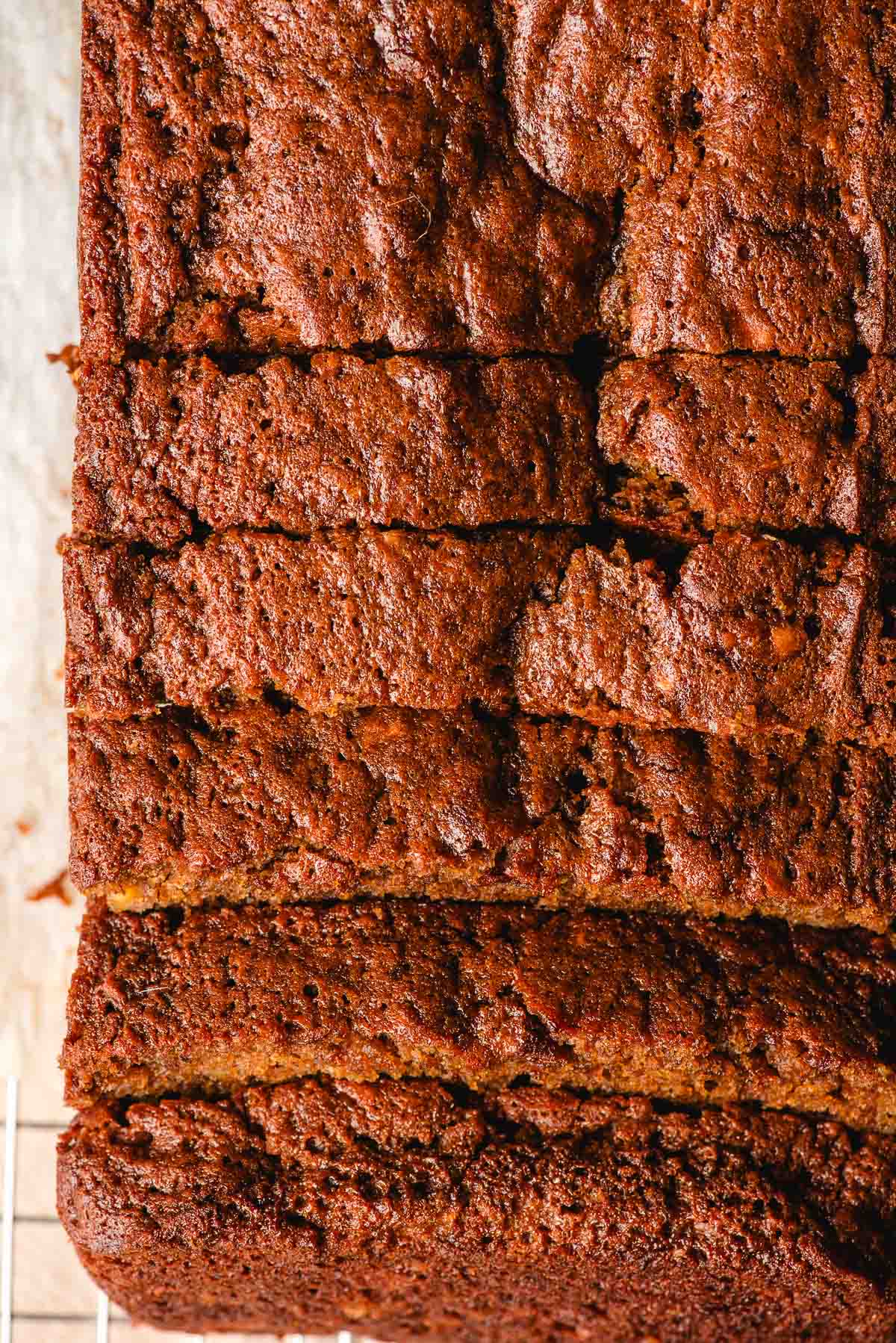 an overhead photo of the whole banana gingerbread loaf sliced into individual pieces