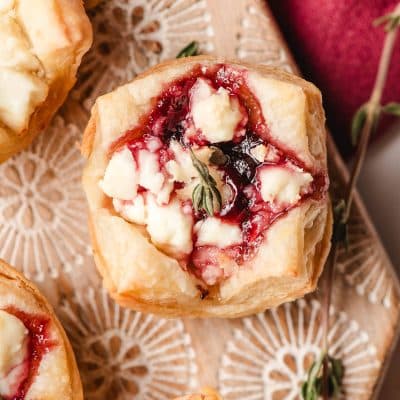 Puff pastry appetizer with goat cheese and jam.