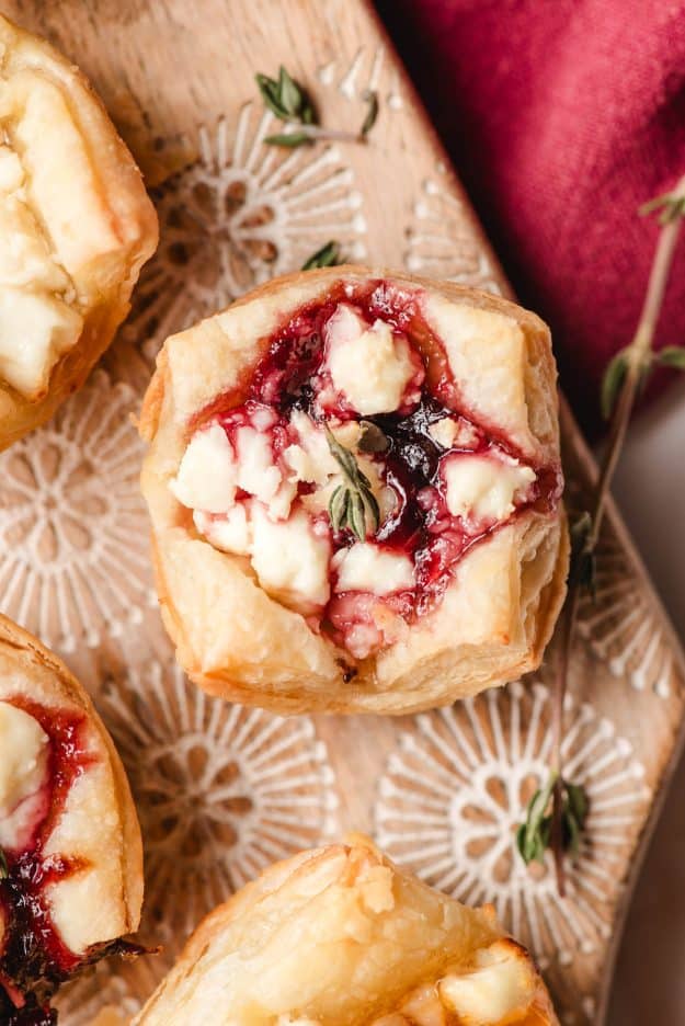 Puff pastry appetizer with goat cheese and jam.