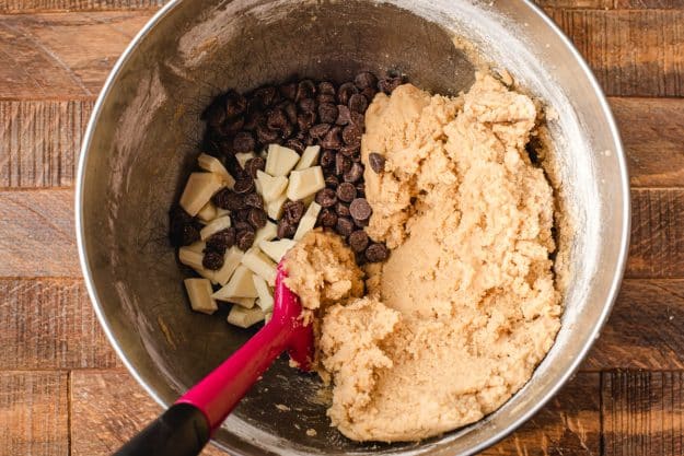 folding chocolate chips into dough