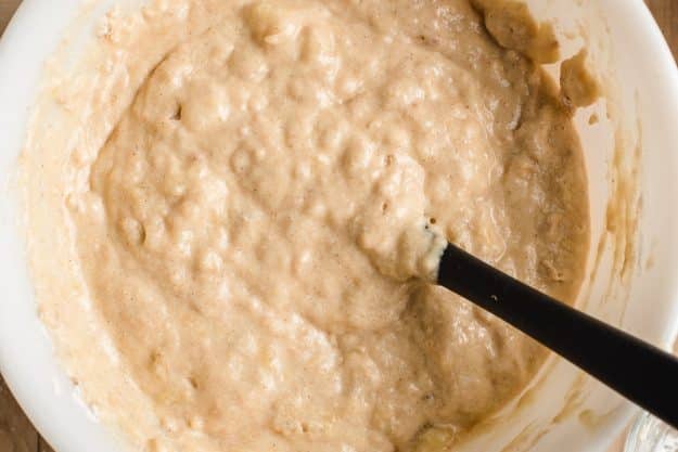 Banana muffin batter in a mixing bowl.