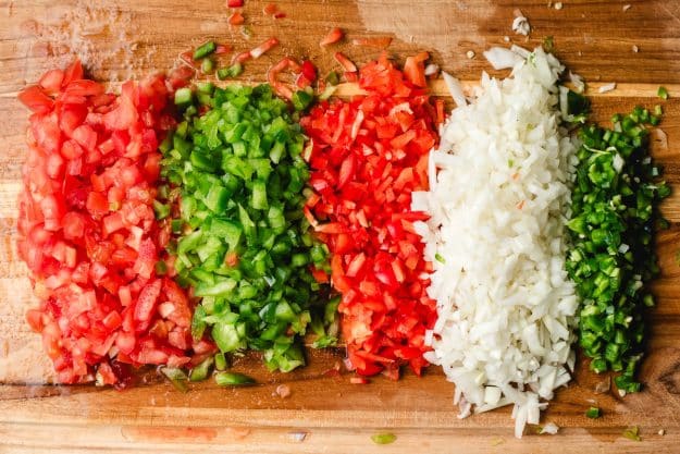 recipe ingredients chopped on a wooden cutting board