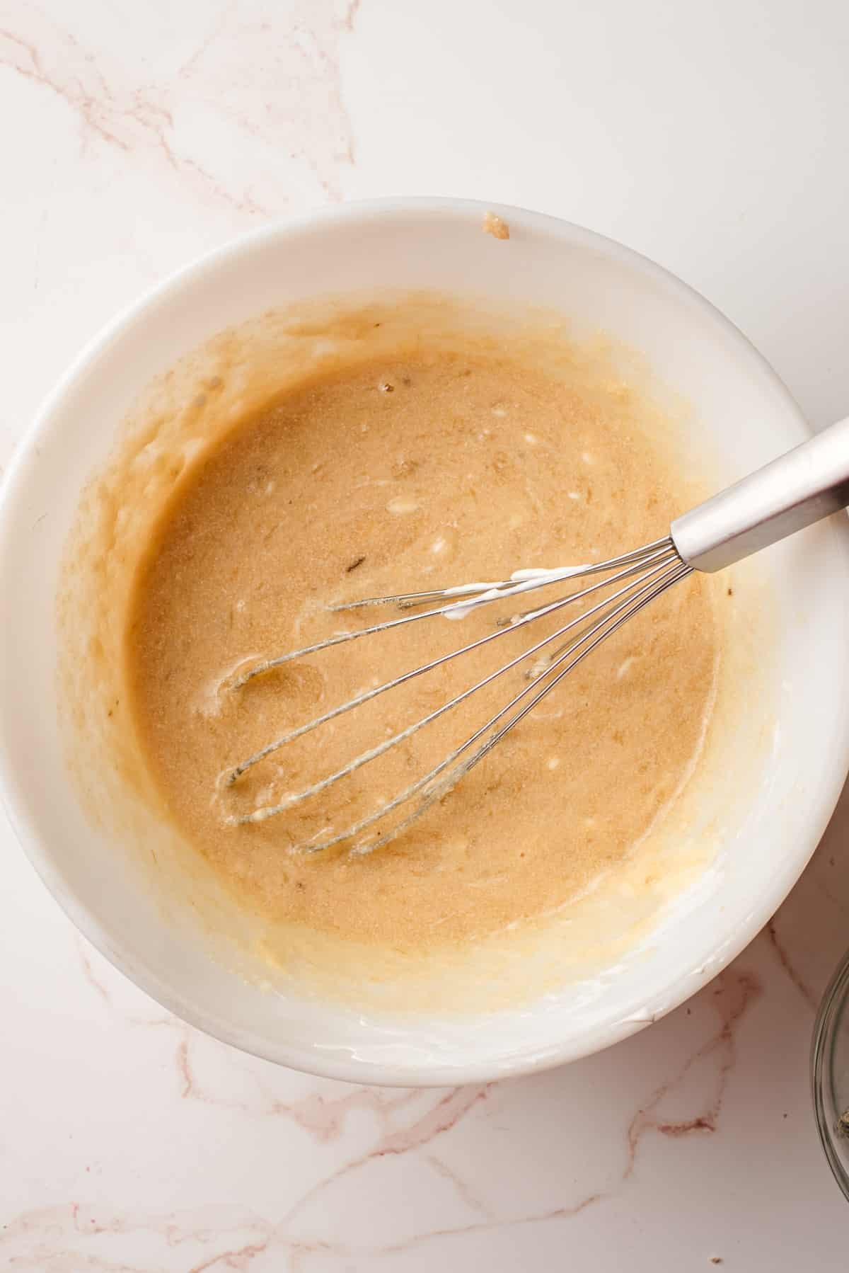 whisking in the sour cream, egg, and vanilla