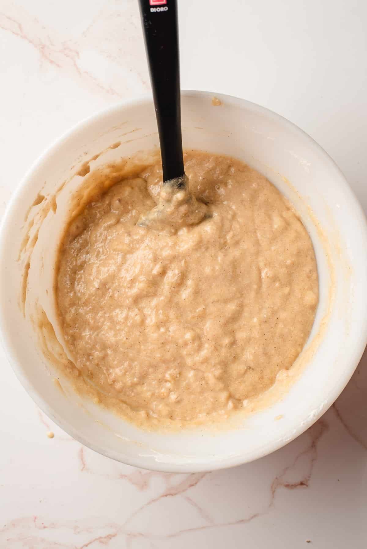 folded batter with wet and dry ingredients mixed together to form the muffin batter