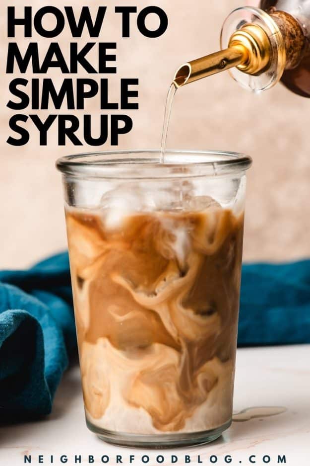 Simple syrup being poured into a creamy iced coffee.