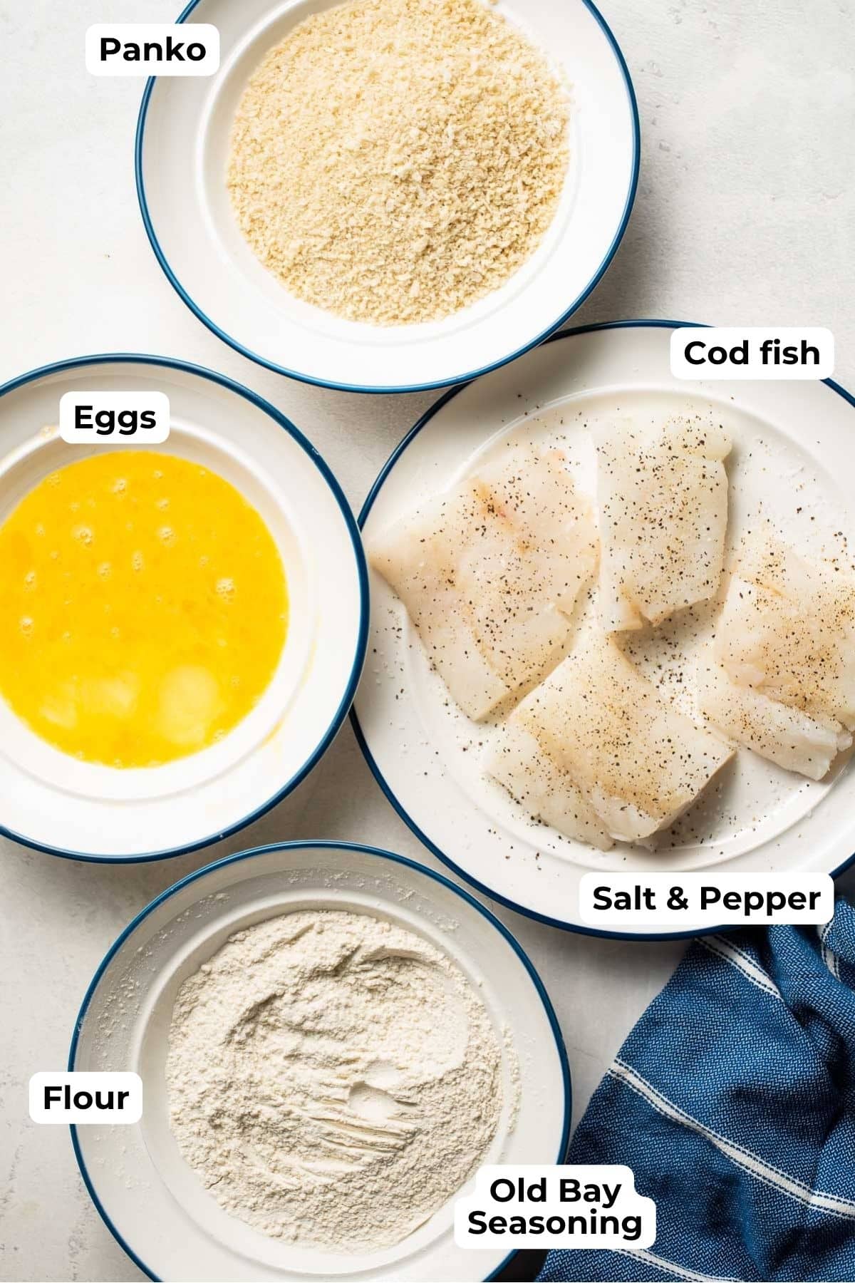 air fryer cod ingredients including panko, cod fish, eggs, flour, and old bay seasoning. 