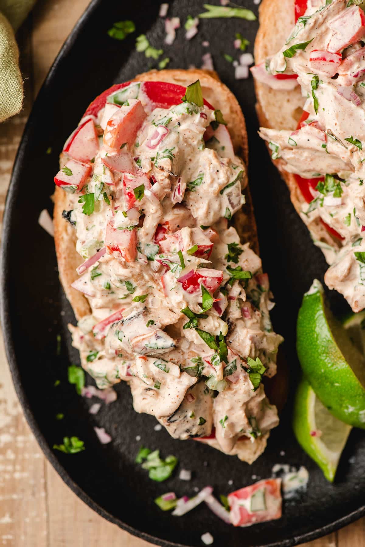 Cilantro lime chicken salad on a slice of bread.