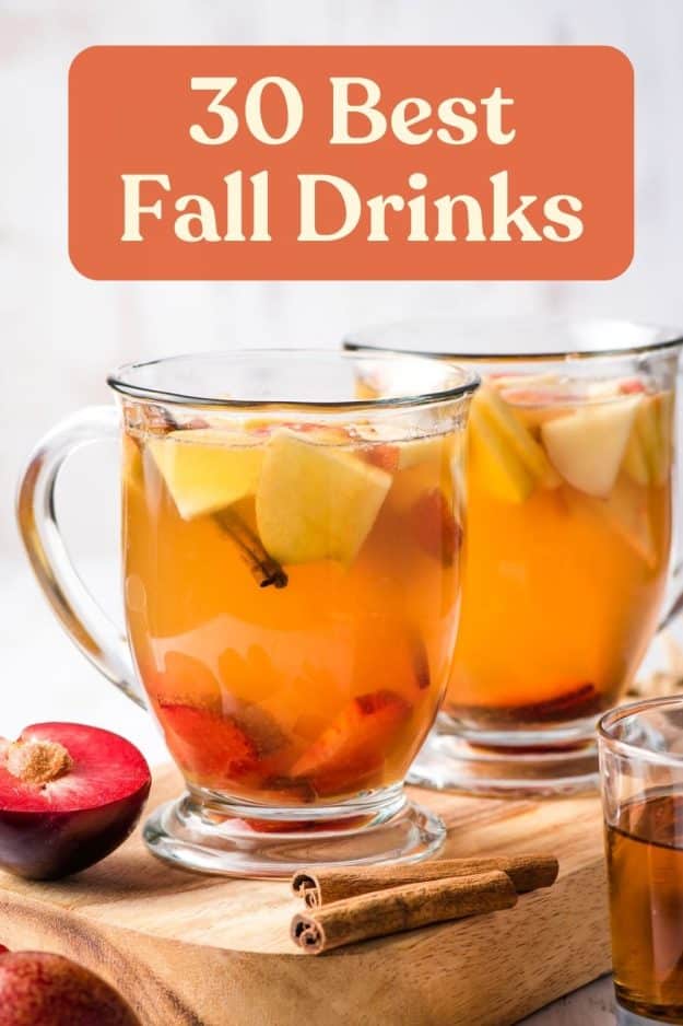 Apple Cider Sangria in two glass mugs with text: "30 Best Fall Drinks"