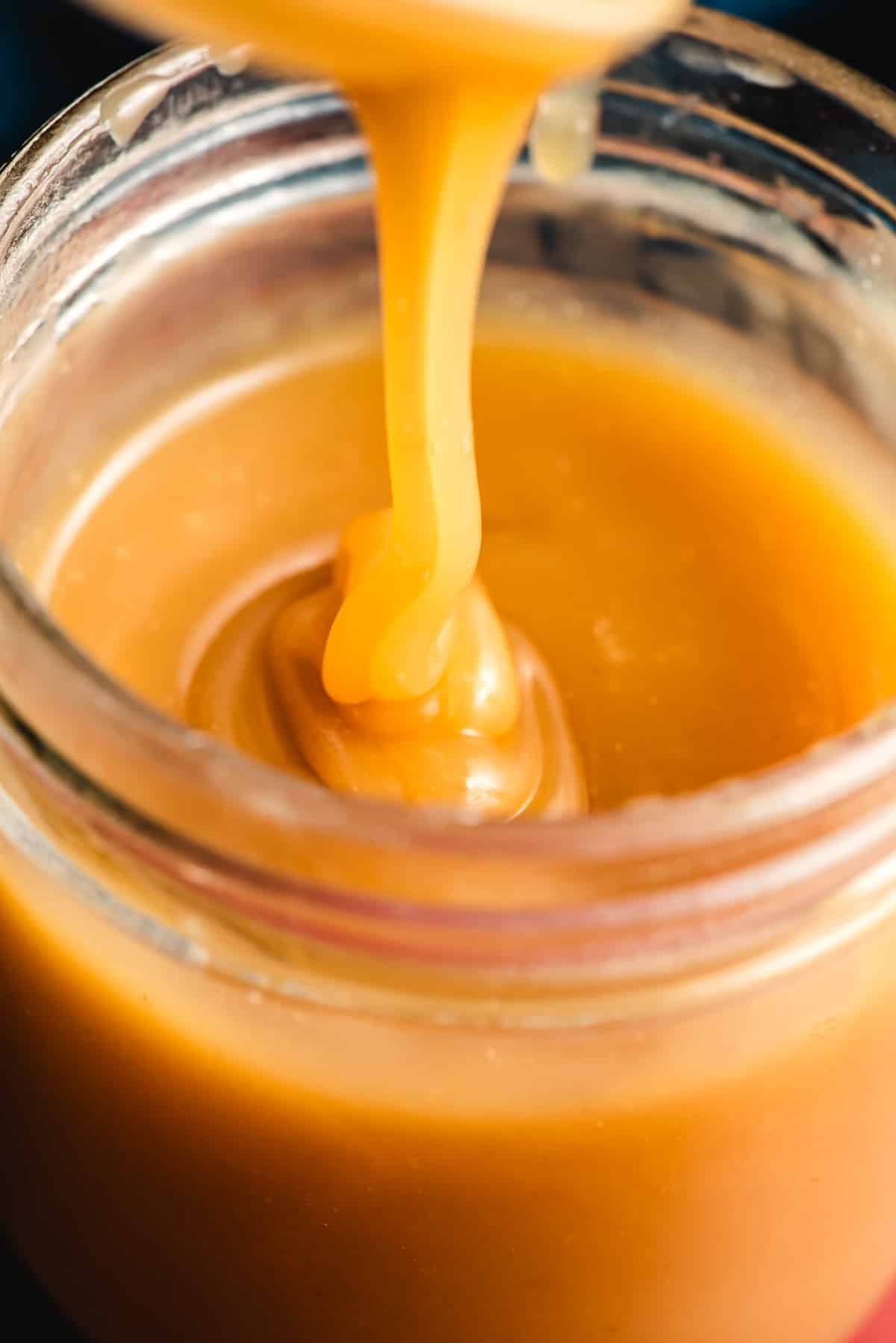 Drizzle of maple caramel sauce in a jar.