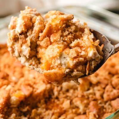 Spoon scooping up a serving of Ritz chicken casserole.