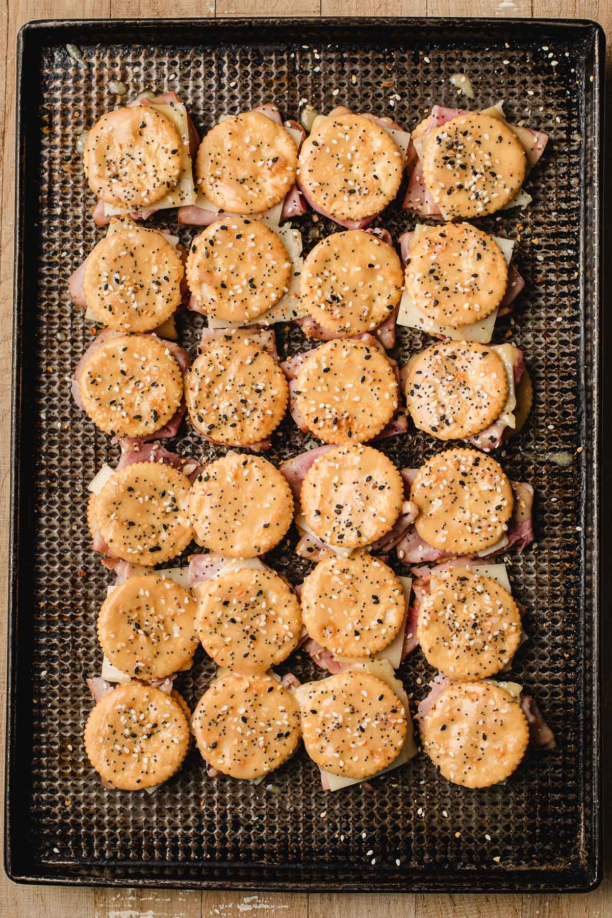 Ritz cracker sandwiches brushed with butter and seasonings.