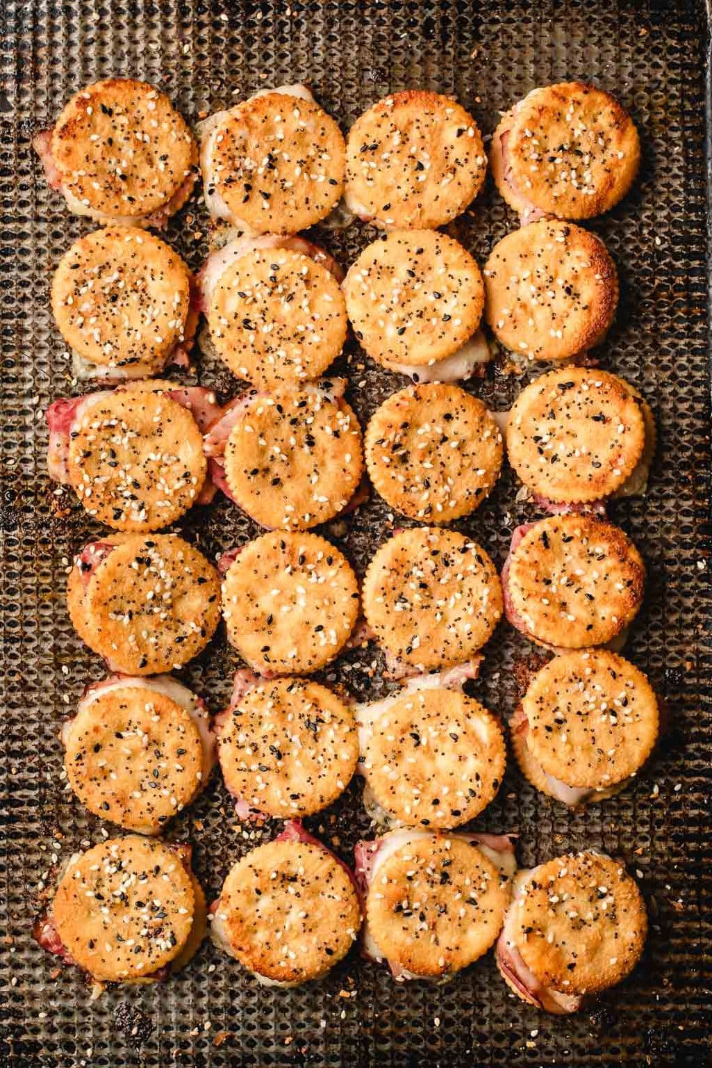 Baked ritz cracker sandwiches with ham and cheese.