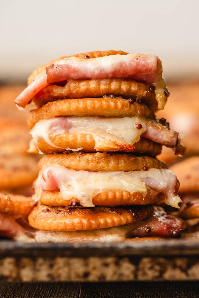 Stack of ham and cheese ritz cracker sandwiches.