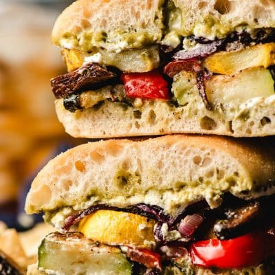 Sliced roasted vegetable sandwich stacked on top of each other.