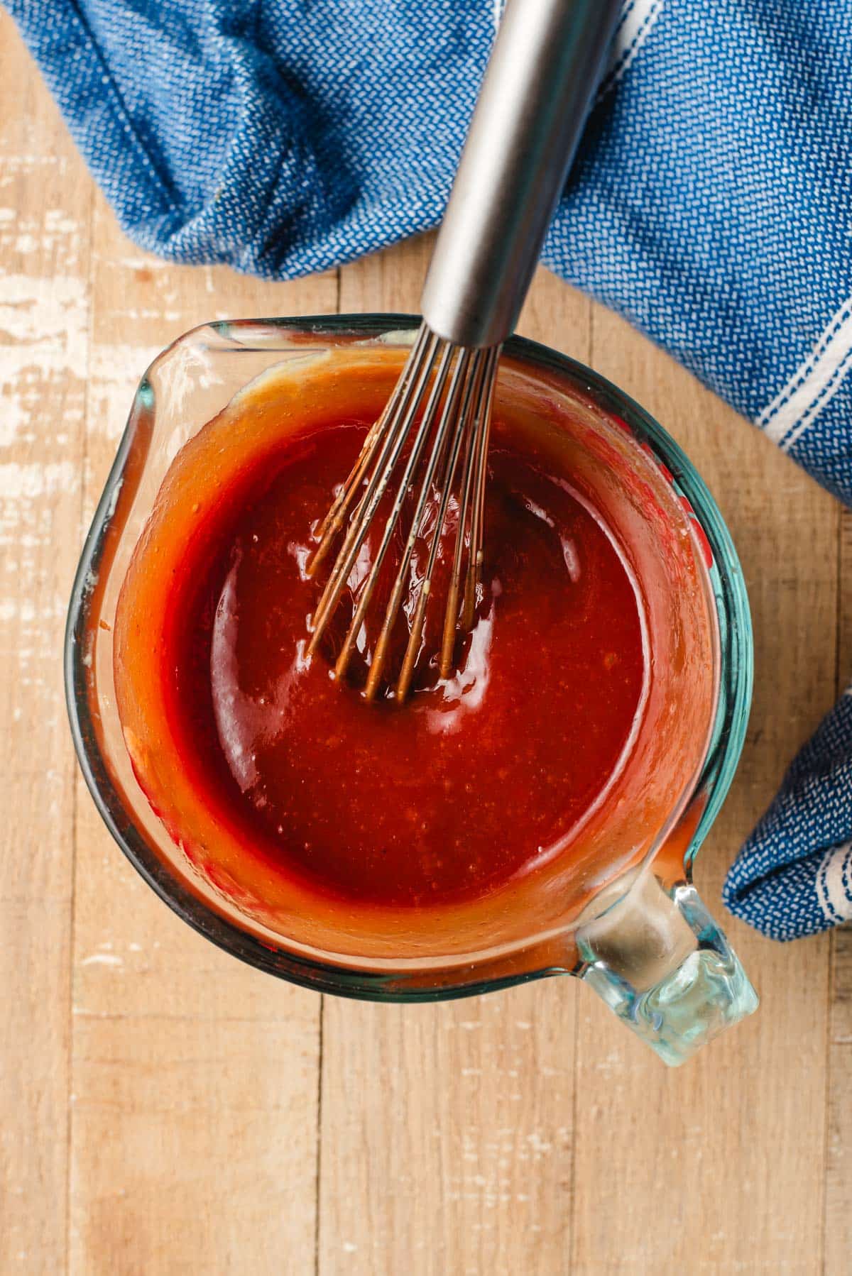 Ketchup, brown sugar, worcestershire, and dijon mustard whisked together in a measuring cup.