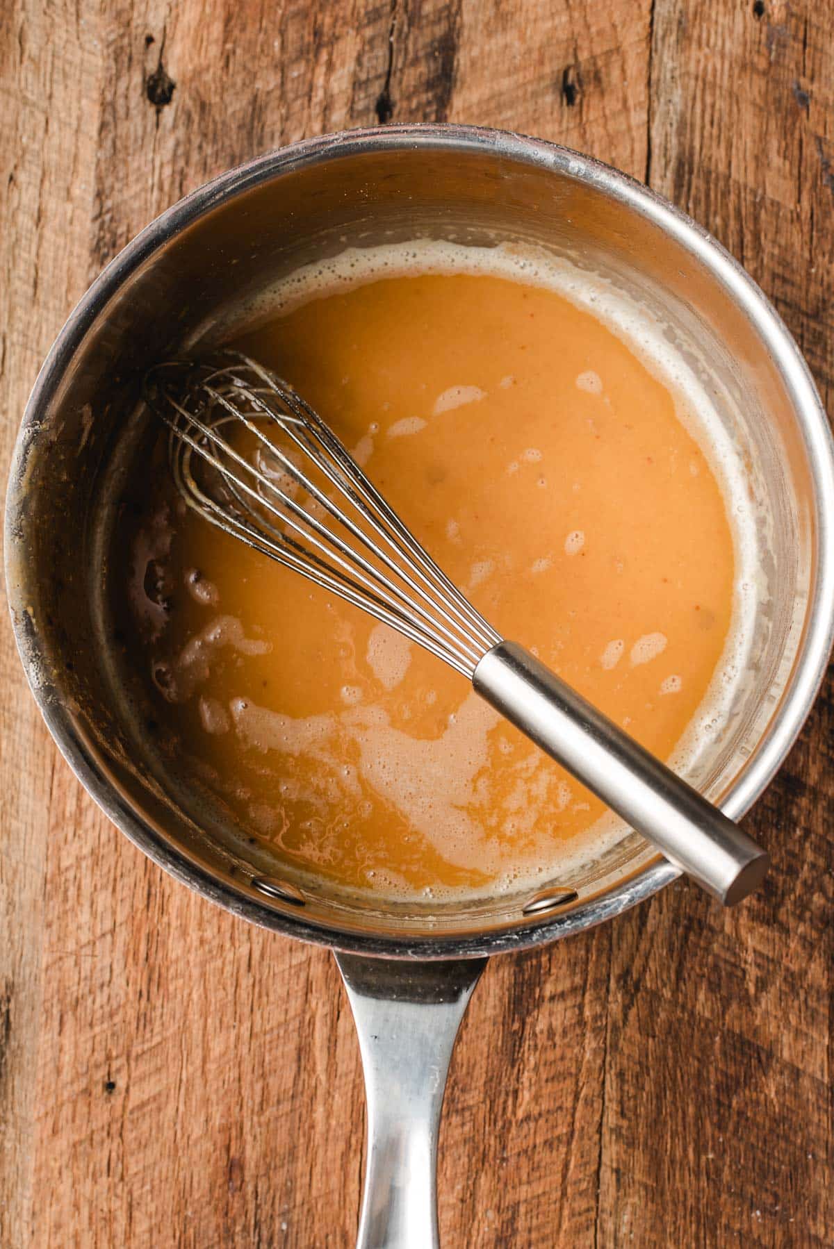 The peanut butter stage of making a roux in a sauce pan.
