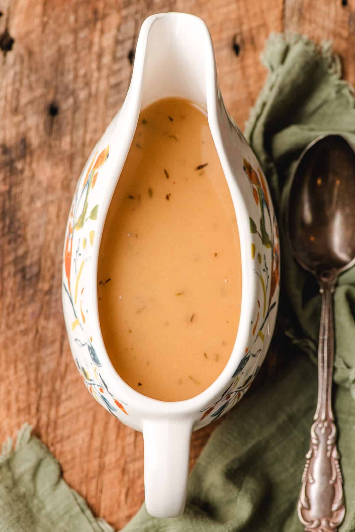 Gravy boat filled with homemade gravy made without drippings.