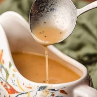 turkey gravy dripping off a gravy spoon.