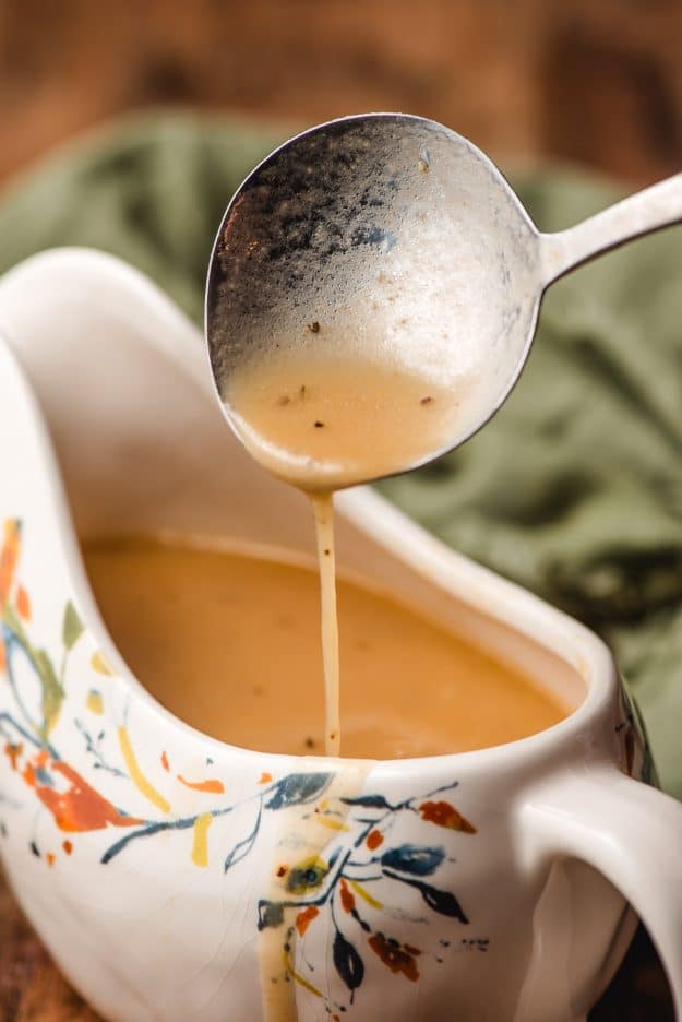 turkey gravy dripping off a gravy spoon.