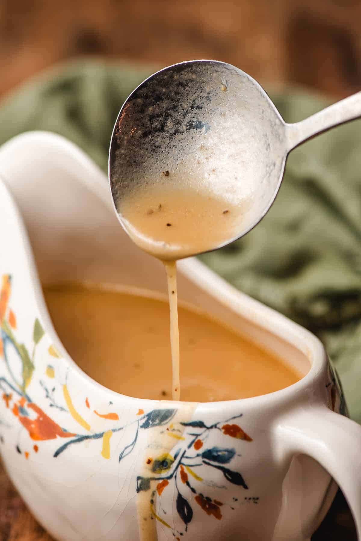turkey gravy dripping off a gravy spoon.