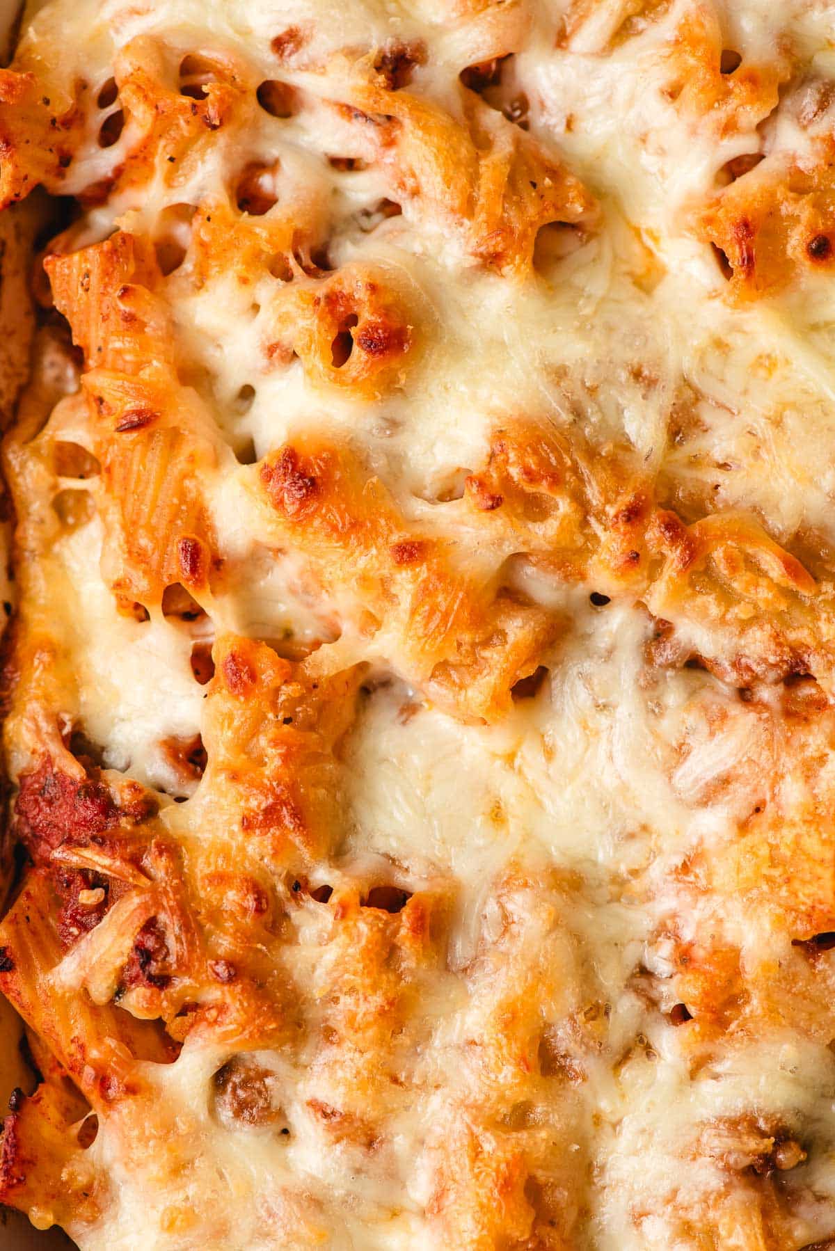 A browned, melty, cheesy rigatoni baked pasta.