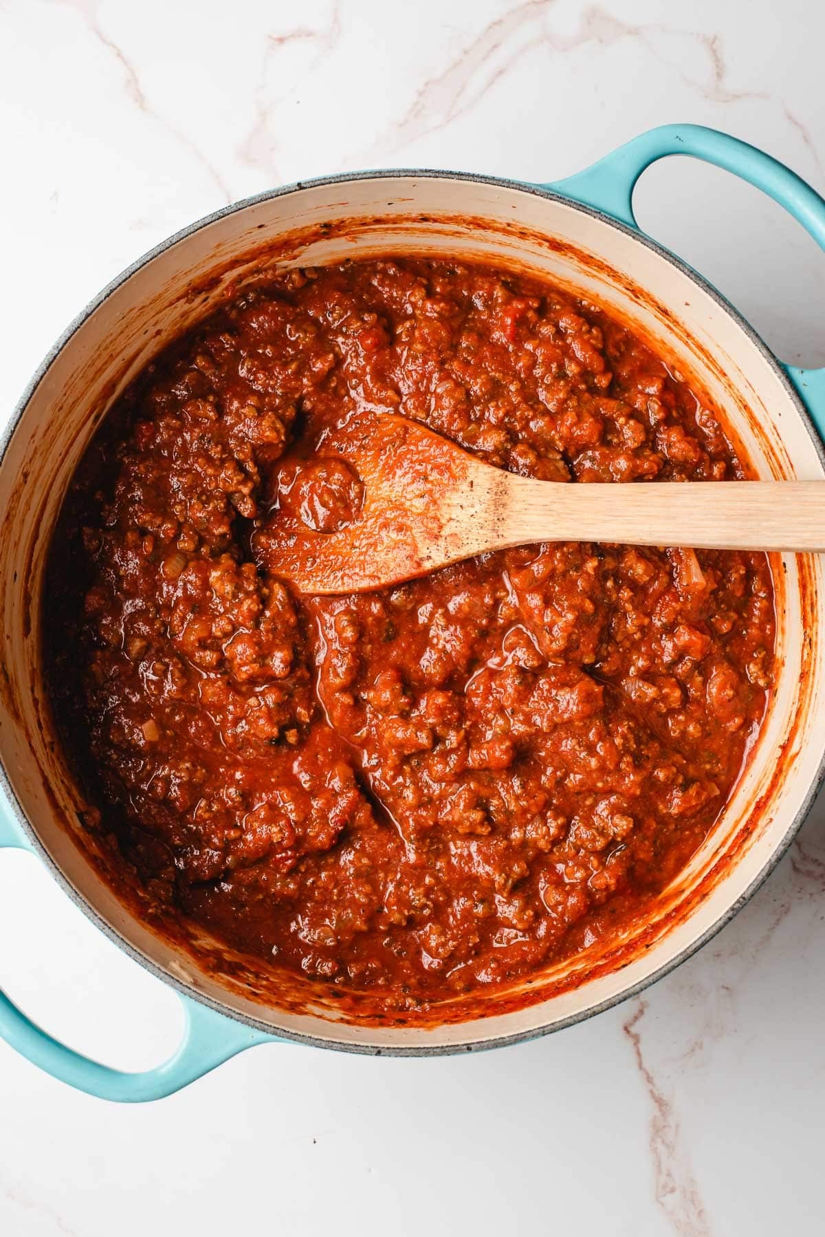 Ground beef and onion sauteed with marinara sauce in a Dutch Oven.