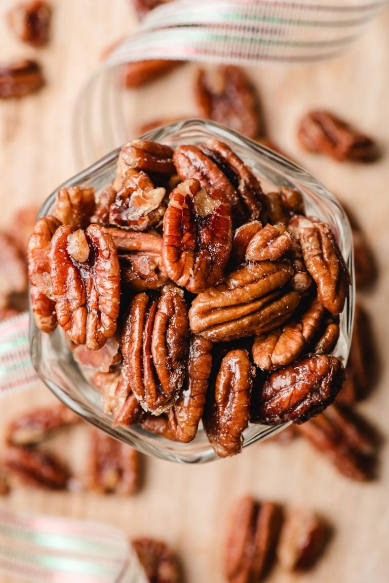 Candied maple pecans in a pretty glass dish.