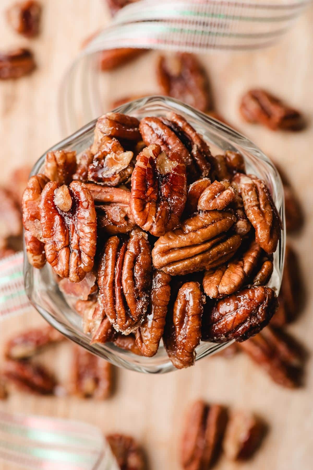 Candied maple pecans in a pretty glass dish.